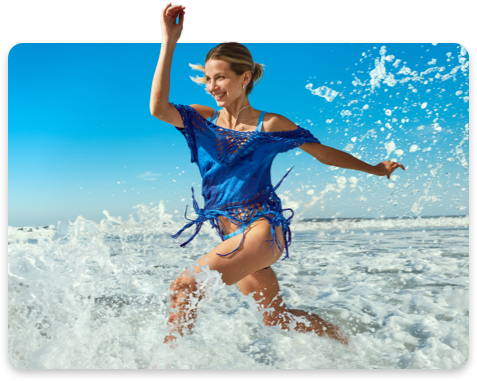 Woman splashing in the ocean.