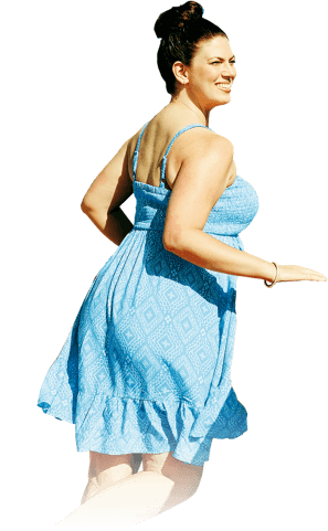 Woman in a blue dress smiles