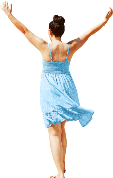 Woman in a blue dress holds up her arms in celebration